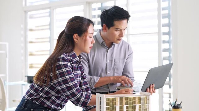 Architecture, design engineers, and architects converse in the office, demonstrating collaboration between civil engineering architect designer team in the workplace, brainstorming for a project.