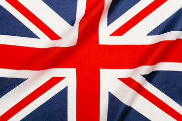Naklejka premium United kingdom union jack flag cloth displaying its national colors, symbolizing sovereignty, patriotism, and british identity
