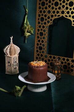 Rich chocolate cream coated cake topped with caramel glaze, nice angle view.