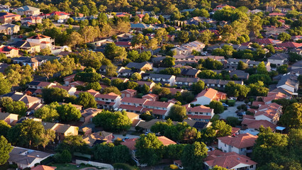 Obraz premium Aerial View of Suburban Houses and Green Trees in Canberra Australia