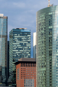 Modern urban skyline in frankfurt features glass towers and a financial office skyscraper creating layered architecture in soft overcast light