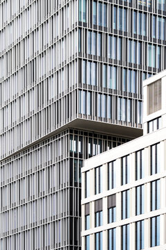 Modern urban architecture in frankfurt focuses on a financial office skyscraper facade where geometric pattern repeats in soft light