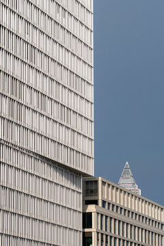 Abstract modern architecture in frankfurt captures a geometric minimal facade on a financial office skyscraper with crisp lines and calm tone