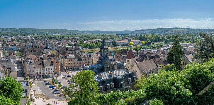 Chateau-Thierry, France - 05 01 2026: Panoramic view of the town hall square, the United Protestant Church, the Balhan Tower, the Marne River and the surrounding countryside with sunny blue sky