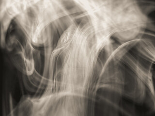 Fototapeta premium abstract monochrome smoke pattern in the dark on a black background