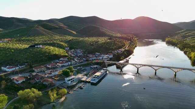 Aerial view of Ponte Almirante Sarmento Rodrigues spanning the Douro river by the village of Barca d'Alva in Distrito da Guarda, Portugal.