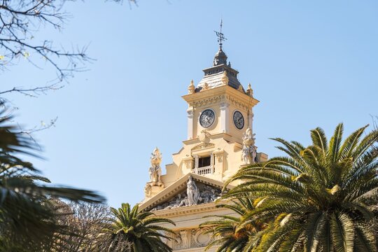 Malaga City Hall upper facade with palm trees neobaroque building Spain
