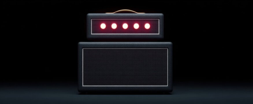 A stack of black amplifiers evokes a sense of power and anticipation.