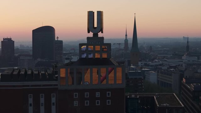 Aerial view of the dortmund u tower and city skyline during a beautiful and hazy sunrise in germany