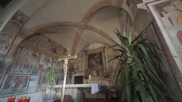 CLUSONE, ITALY - MARCH 9, 2026: San Defendente ancient frescoed Oratory interior
