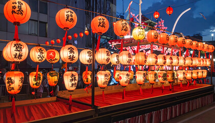 Fototapeta premium Traditional Japanese Lanterns Illuminate a Festive Evening Street Scene.