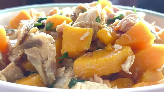 Fried squash butternutwith chicken in plate, indoor Chiangmai Thailand