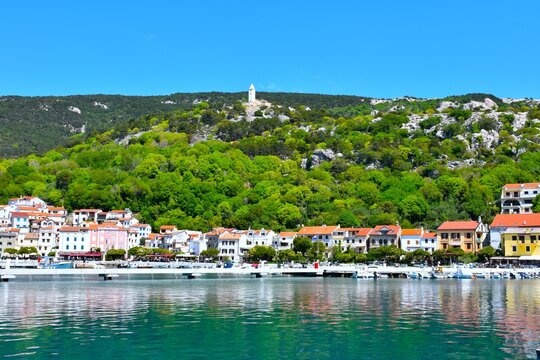 Church at a hill above the buildings in the coastal town of Ba&scaron;ka at Krk in Kvarner, Croatia