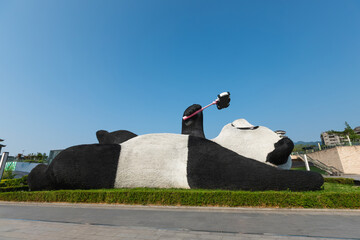 Gigantic sculpture of selfie-taking panda gains popularity or "Selfie Panda" is iconic of Dujiangyan Chengdu Sichuan China © lzf