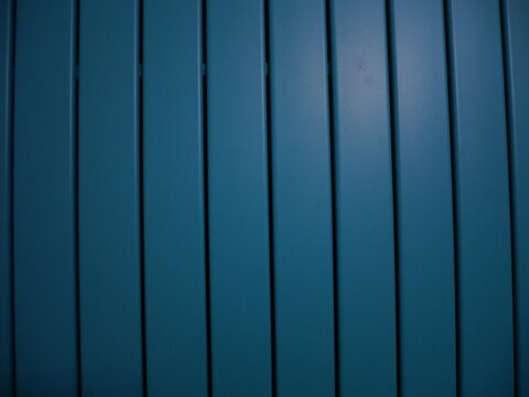 Dark Blue Vertical Metal Panels Background with Shadow Lines