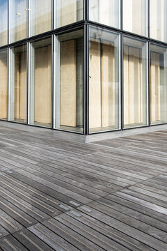 Spacious walkway deck sets architecture building glass facade windows in modern minimal perspective with clear foreground space for design copy