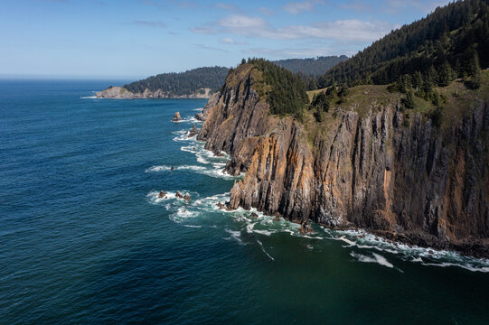 Aerial drone photo of rugged cliffs and ocean waves along the Oregon Coast near Elk Flats Trail, Cape Falcon, Angora Peak, Neahkahnie Mountain, Manzanita USA. Scenic Pacific Ocean shoreline landscape