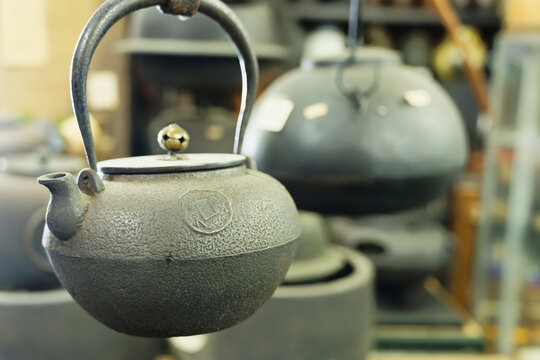 Close Up of Traditional Cast Iron Teapot Displayed in a Craft Shop