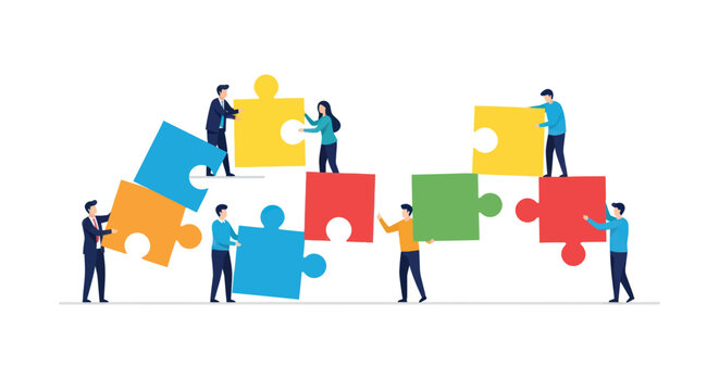 People working together with puzzle pieces.