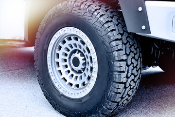 Off road vehicle tire close up with rugged tread © Sergey Ryzhov