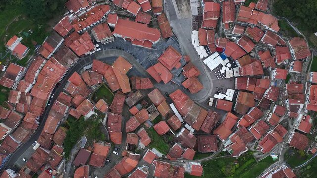 Aerial view of the historic village with its characteristic red-tiled rooftops and narrow winding streets Cudillero, Asturias, Spain.