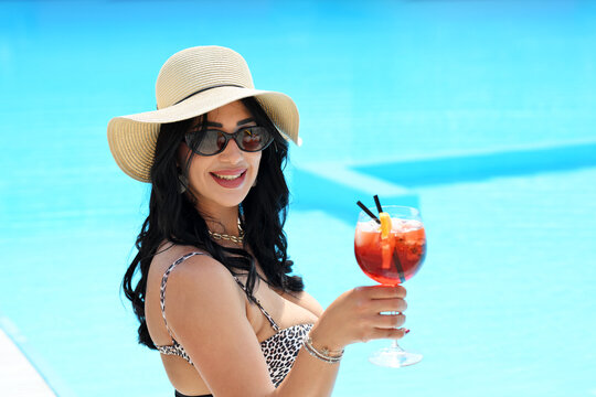 Beautiful brunette woman with cocktail