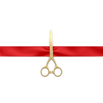 Gold scissors cutting a red ribbon on a white background