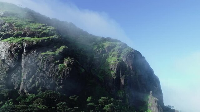 Drone view of Kotebetta cliffs in Western Ghats covered in mist and scenic natural beauty