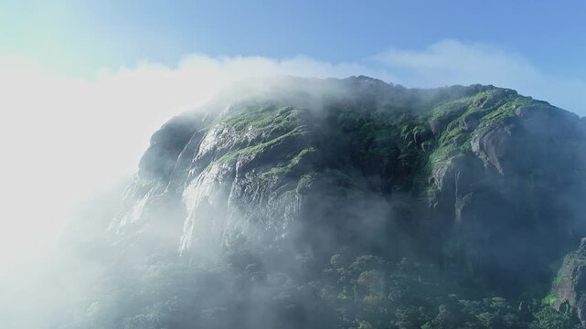 Drone view of Kotebetta cliffs in Western Ghats covered in mist and scenic natural beauty