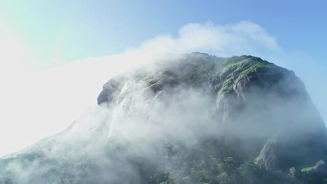 Drone view of Kotebetta cliffs in Western Ghats covered in mist and scenic natural beauty