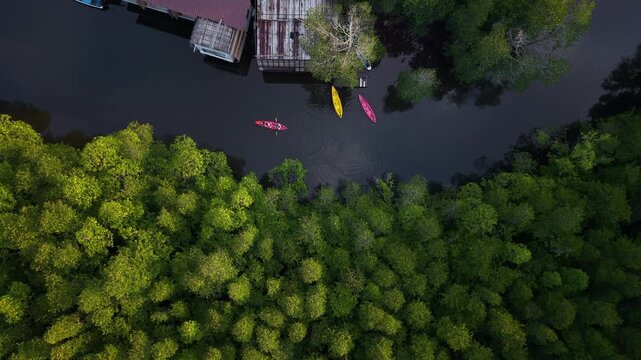 Aerial view of a traditional coastal village living in harmony with nature, showcasing sustainable living and slow life.
