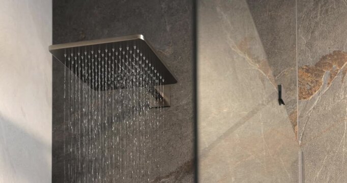 Square shower head in modern stone wet zone, static interior video captures the moment water begins to fall from the sleek fixture across dark and light surfaces in a premium bathroom setting