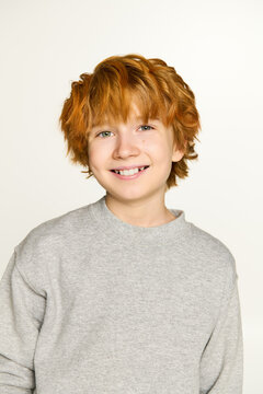 Charming little boy in stylish outfit radiates joy and confidence in vibrant fashion moment.