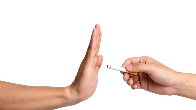 Man hand making stop gesture to refuse a cigarette, quitting smoking concept