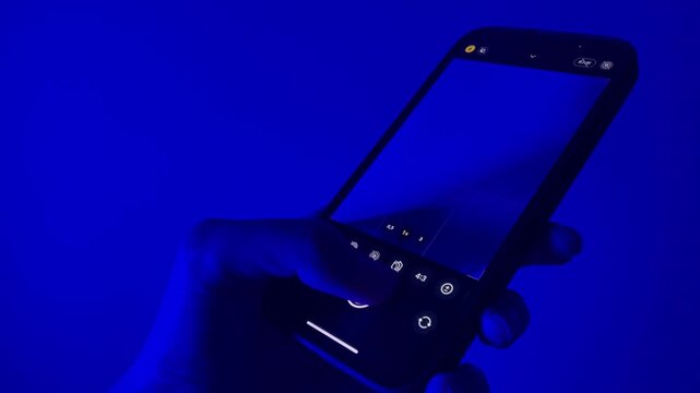 woman hand holding phone and taking a photo with flash. woman hand holding phone and taking a photo close up view