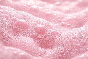 Obraz premium Soft pink foam bubble texture in a close-up macro showcasing an abstract smooth surface for artistic backgrounds