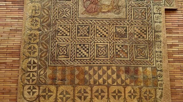 Roman mosaic made with stone and marble tesserae. Roman art for decorating the floors of Roman villas. Image of the myth of the sirens of ancient Rome. M&eacute;rida. Spain.