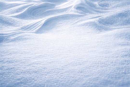 Wintery snow surface showing textured snow and wind shaped designs overhead with text area