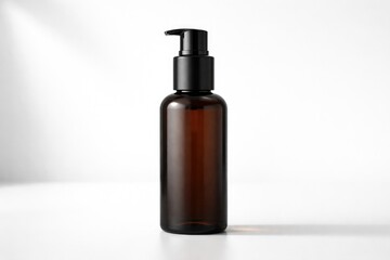Fototapeta premium Minimalist dark brown cosmetic bottle with pump on white background ideal for branding displays