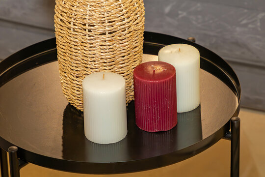 Candles on metal table inside room interior