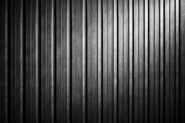 Obraz premium Rough vertical ribbed metallic texture under studio lighting for wall background copy space