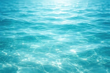 Fototapeta premium Vivid turquoise water with delicate ripple textures and glowing light reflections copy space