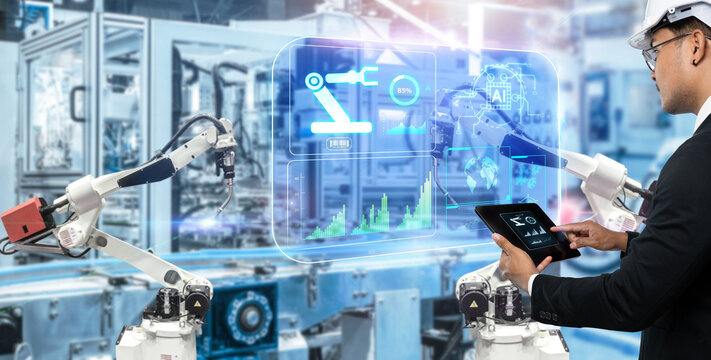 Smart technology industry control concept.Hands holding tablet on blurred automation machine as background
