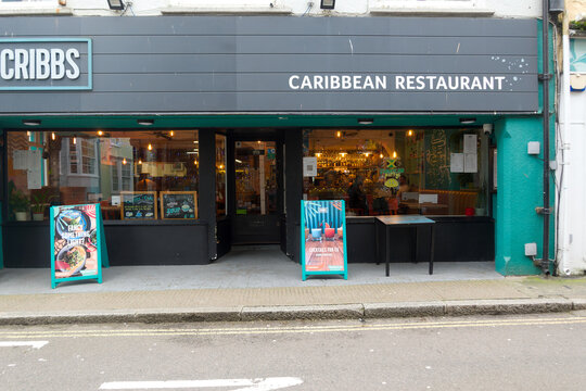 Cityscape at English city of Falmouth with Cribbs Caribbean restaurant on a cloudy winter day. Photo taken February 2nd, 2026, Falmouth, United Kingdom.