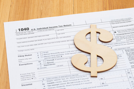 1040 Tax form with dollar symbol