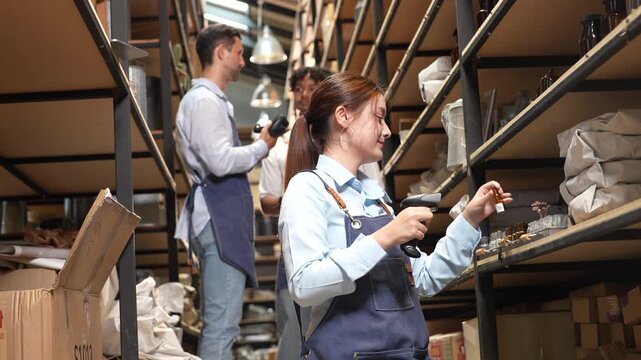 Asian female warehouse employee using barcode scanner for inventory management, E-commerce SME business owner checking retail stock distribution, Commercial logistics and shipping supply chain concept
