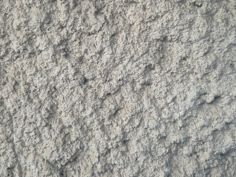 Gray rough wall with pronounced texture