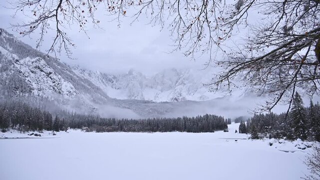 Winter in the Julian Alps. Snow-covered Fusine Lakes. Magic and winter atmospheres among the woods and rocky peaks of Friuli.