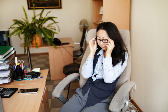 Drained restless woman going into mental haze with after hours tasks, rubbing eyes and struggling to stay awake. Employee with intense workload and discomfort feels anxious and overwhelmed.