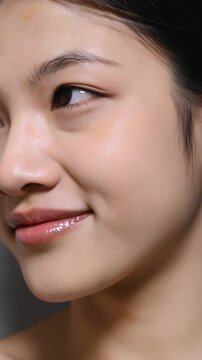 Cosmetics Skin Care Concept Video of Close-up Woman Perfect Face with Hydrated Skin. Vertical